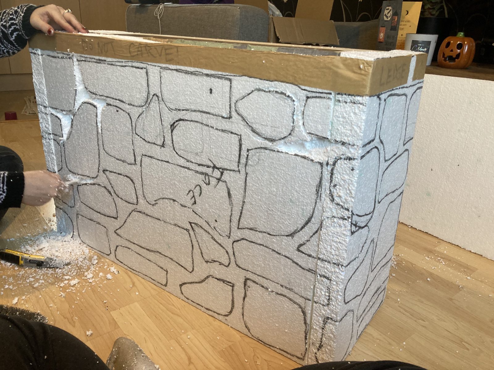 The Hounds of Baskerville - Process photo of the window sill wall, we covered this wooden box in thick polystyrene so we could carve out stones to create a stone wall